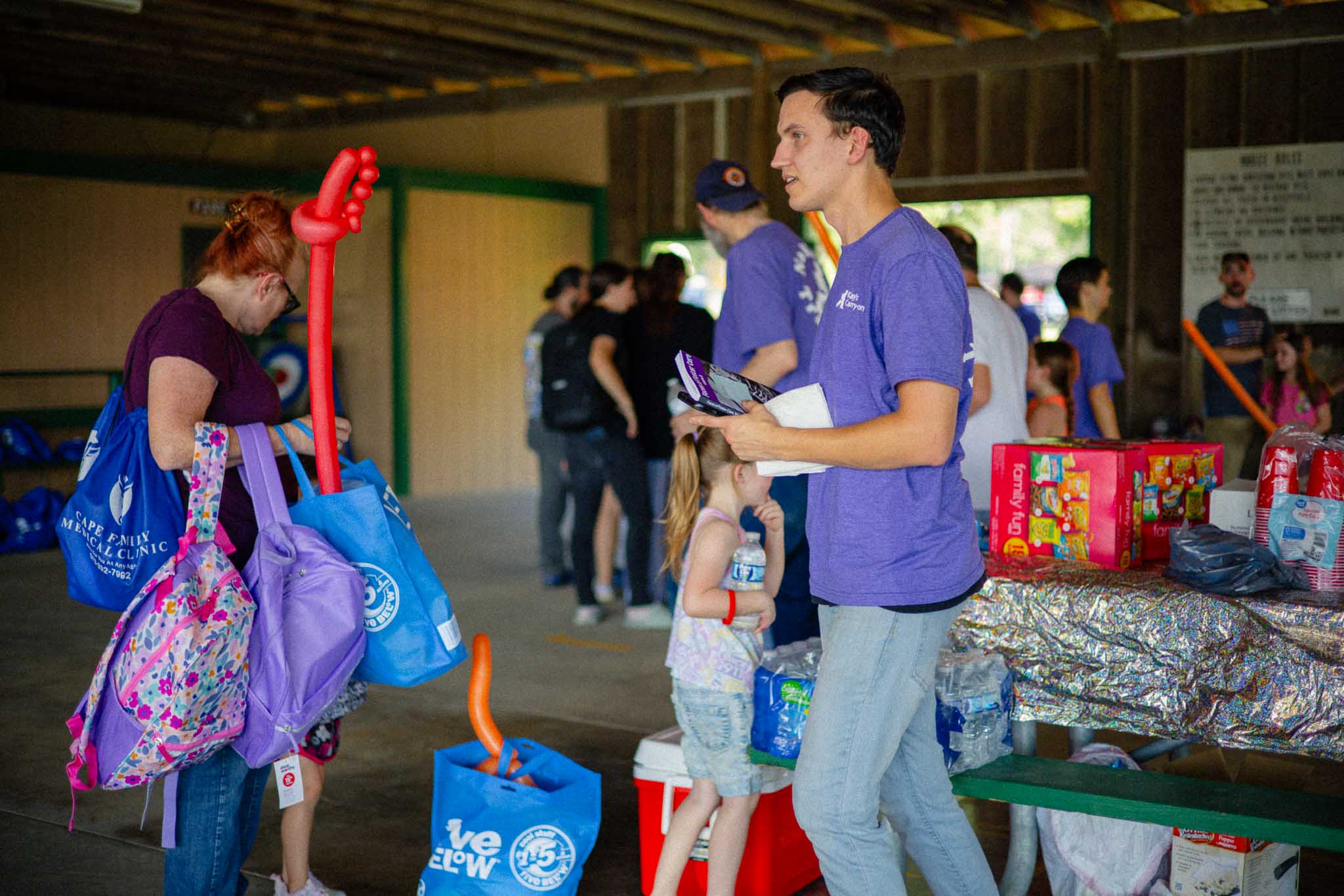 Impact One More volunteer helping lead an outreach
